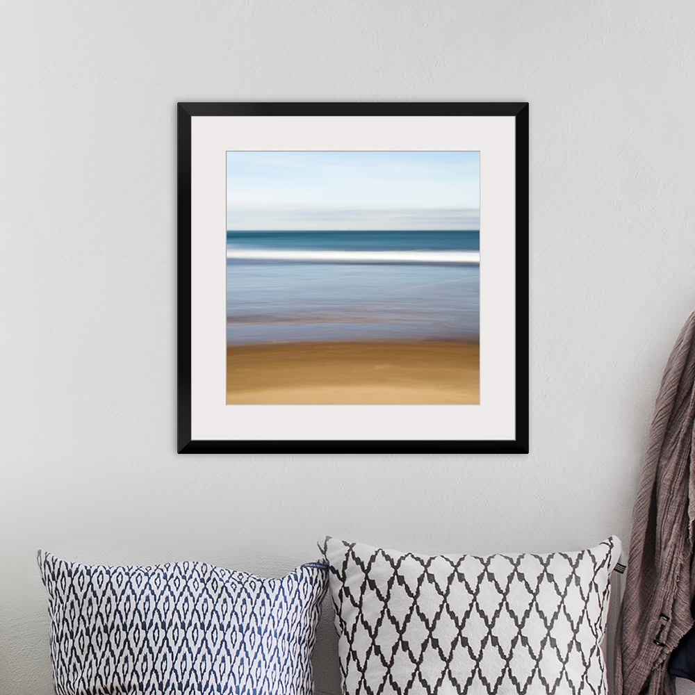 A bohemian room featuring A square canvas of a peaceful seascape with smooth color transitions.
