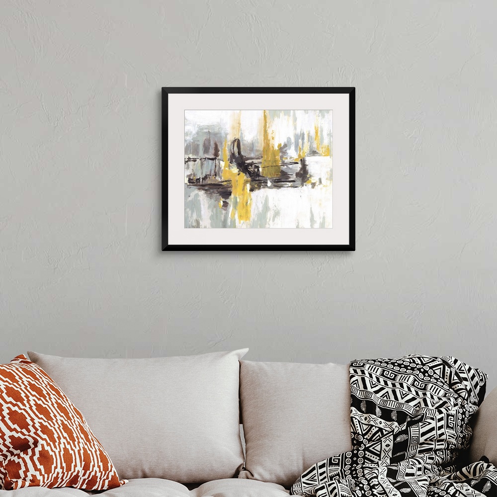 A bohemian room featuring Contemporary abstract artwork in black and white embellished with bright yellow areas.