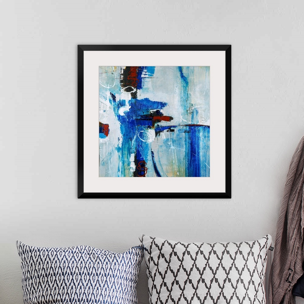 A bohemian room featuring Abstract painting of bright blue brustrokes against a gray-blue background.