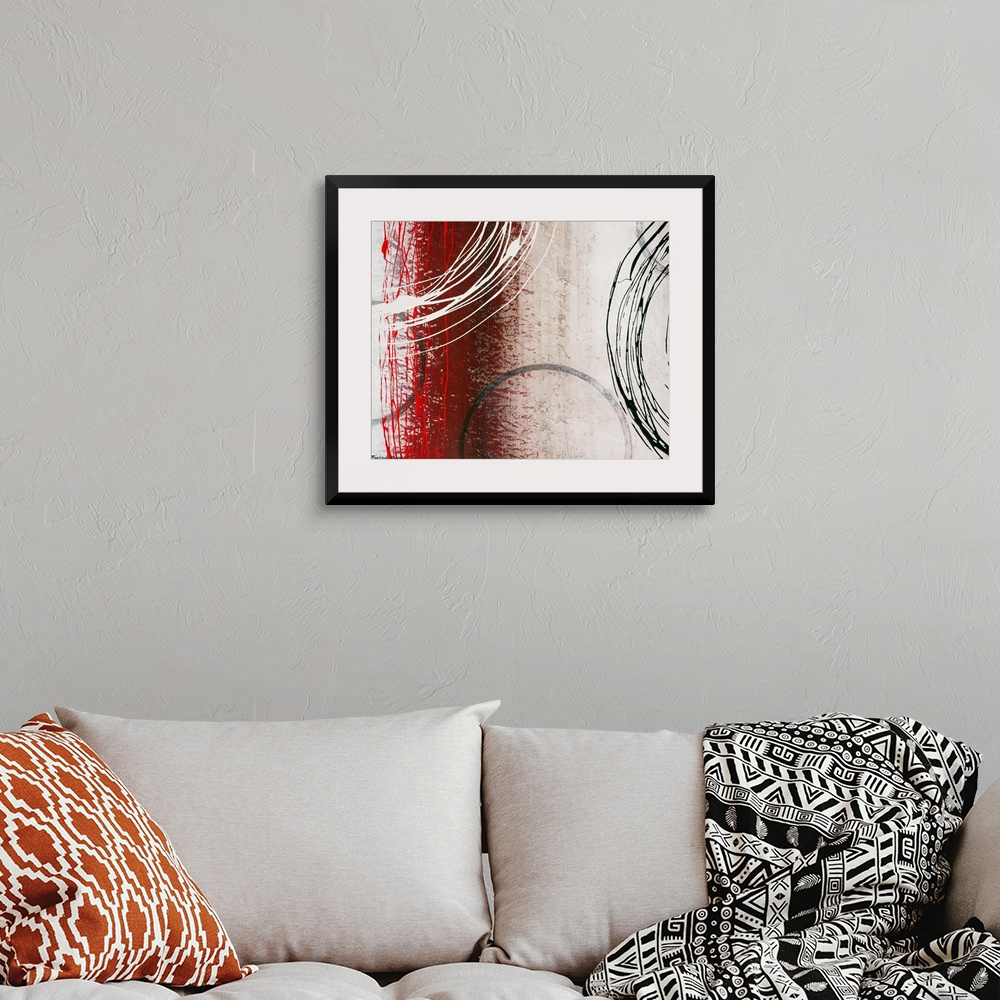 A bohemian room featuring Abstract painting of  overlapping circles and lines.  The background has distressed vertical band...