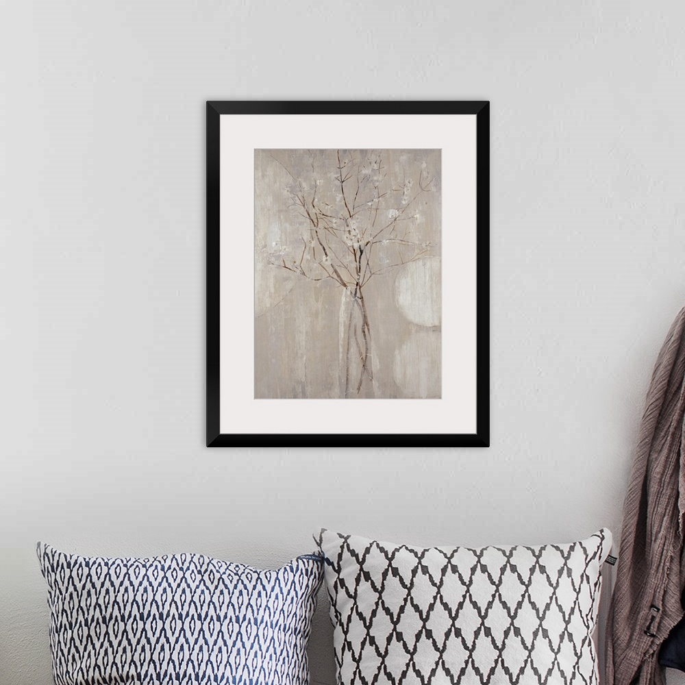 A bohemian room featuring A monochromatic vertical painting of  twigs with tiny flowers.