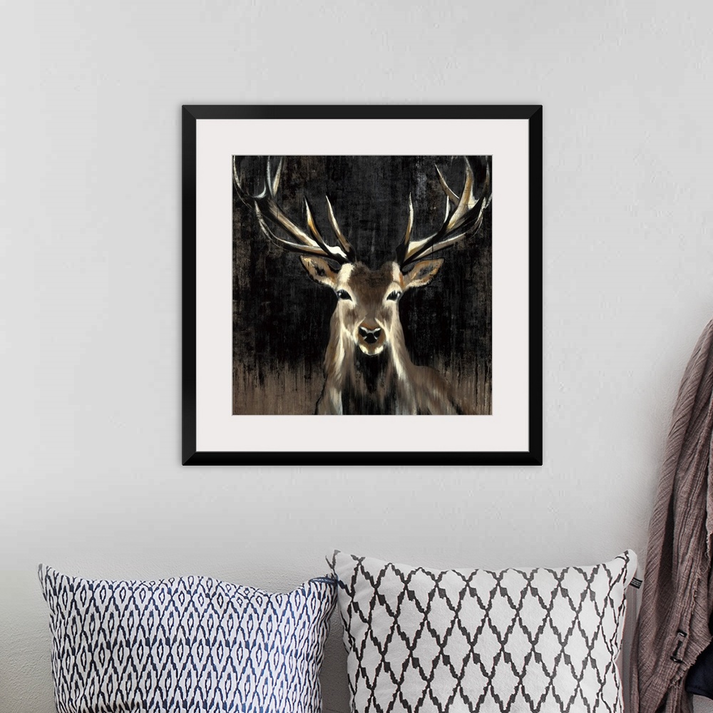 A bohemian room featuring Contemporary painting of a stag against a dark background.
