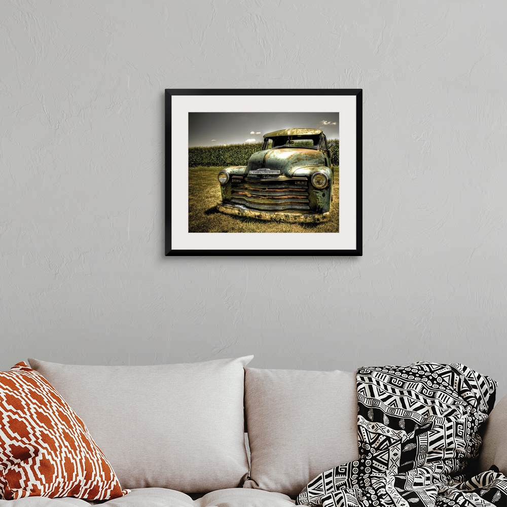 A bohemian room featuring A photo on canvas of a vintage Chevrolet truck parked in front of a corn field.