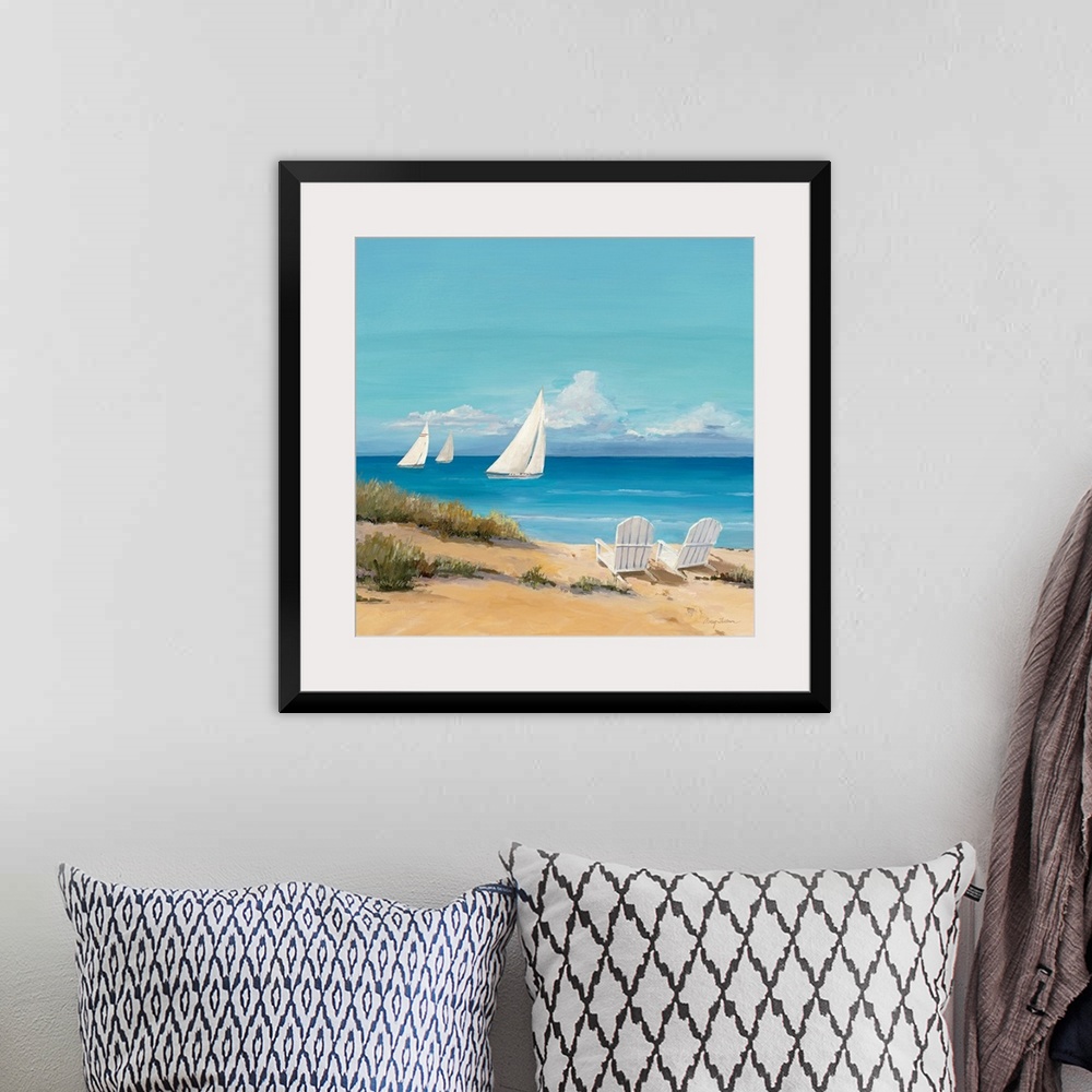 A bohemian room featuring Large contemporary art shows a trio of sailboats traveling through the open waters of an ocean on...