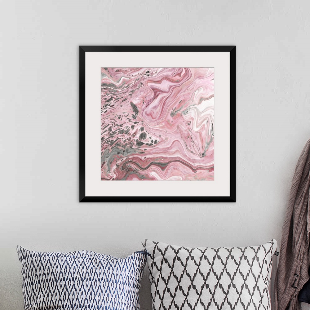 A bohemian room featuring Square abstract decor with marbling colors of pink, gray, and white.