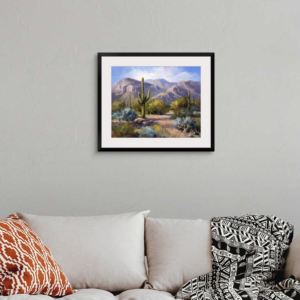 A bohemian room featuring Contemporary landscape painting of the southwest.
