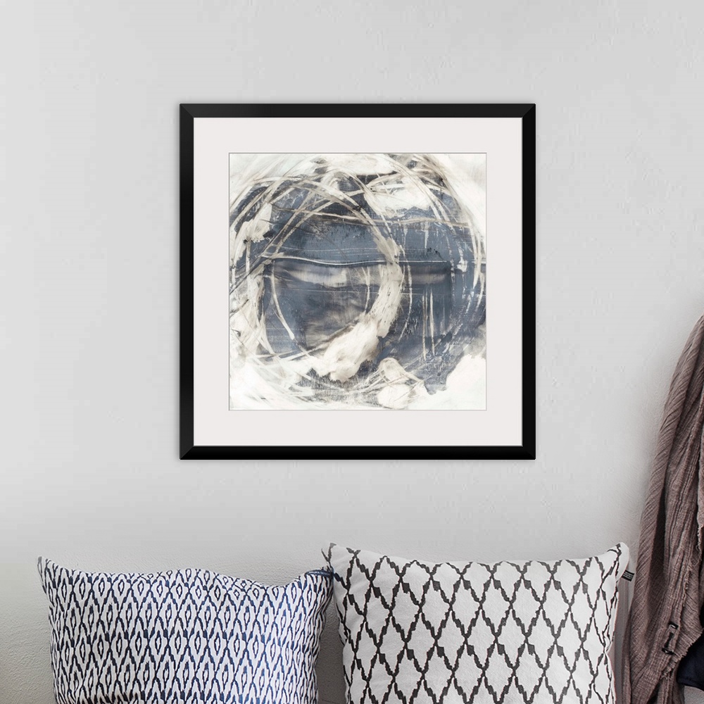 A bohemian room featuring An organic, rounded abstract painting that resembles the earth surrounded by swirling clouds.