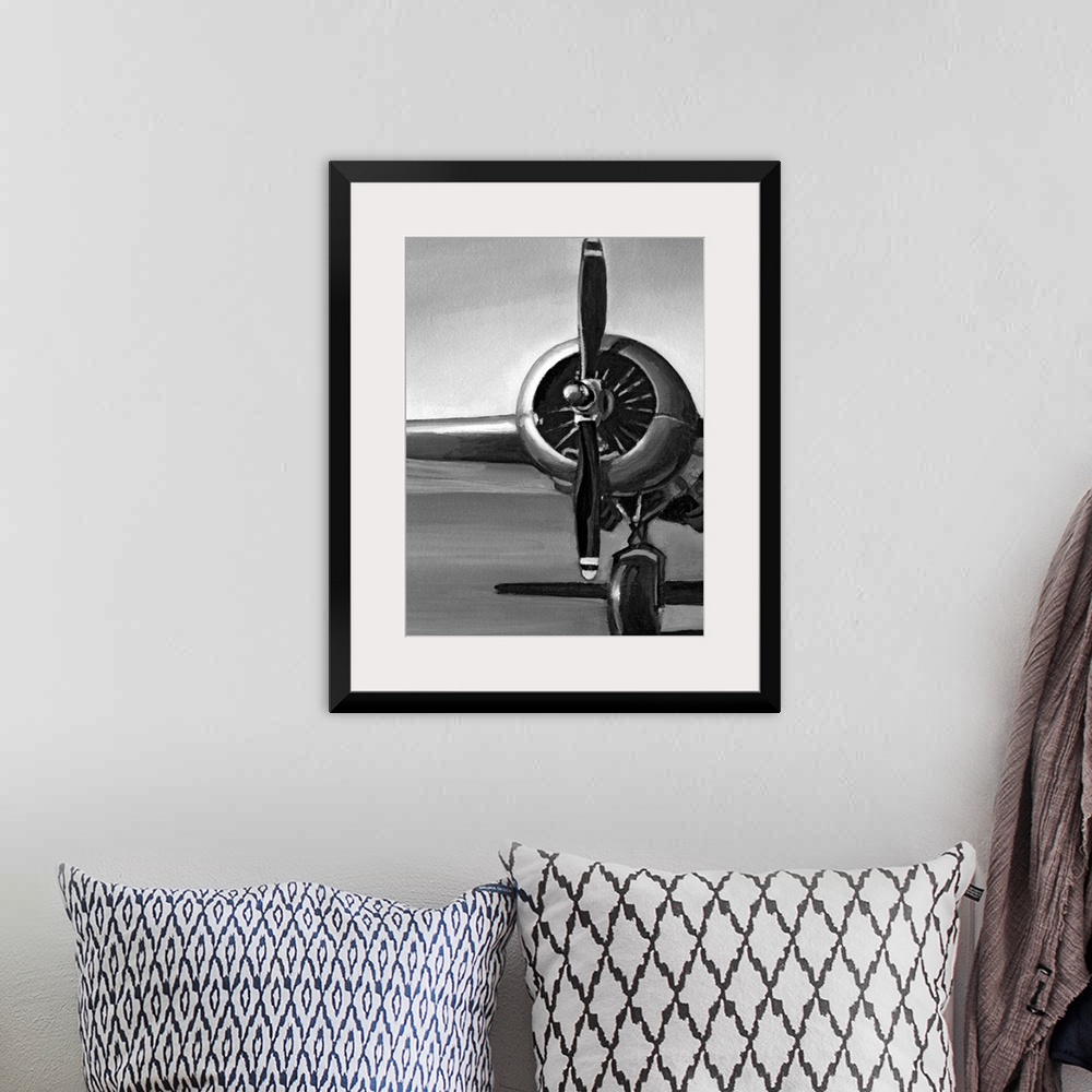 A bohemian room featuring Vertical, oversized artwork of a wing, propeller and wheel on a vintage airplane, casting a shado...