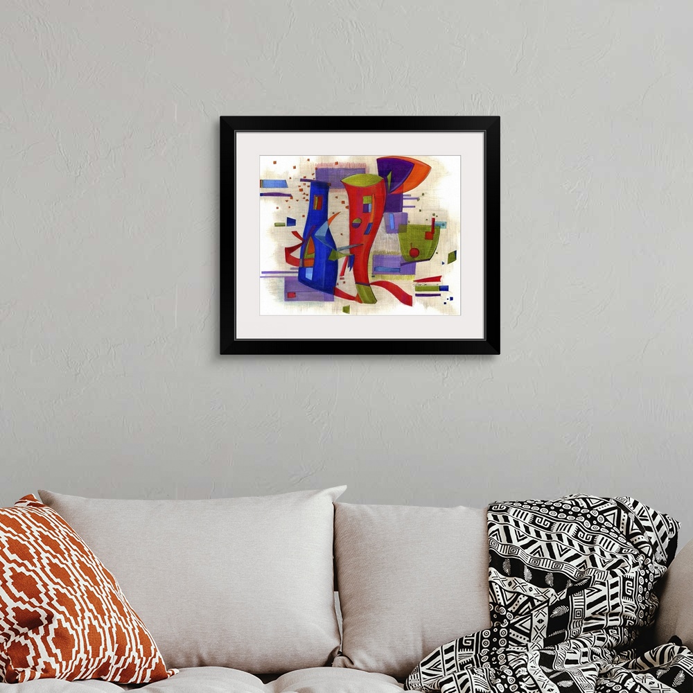 A bohemian room featuring Horizontal abstract painting of vibrant colored shapes in circles and rectangles.