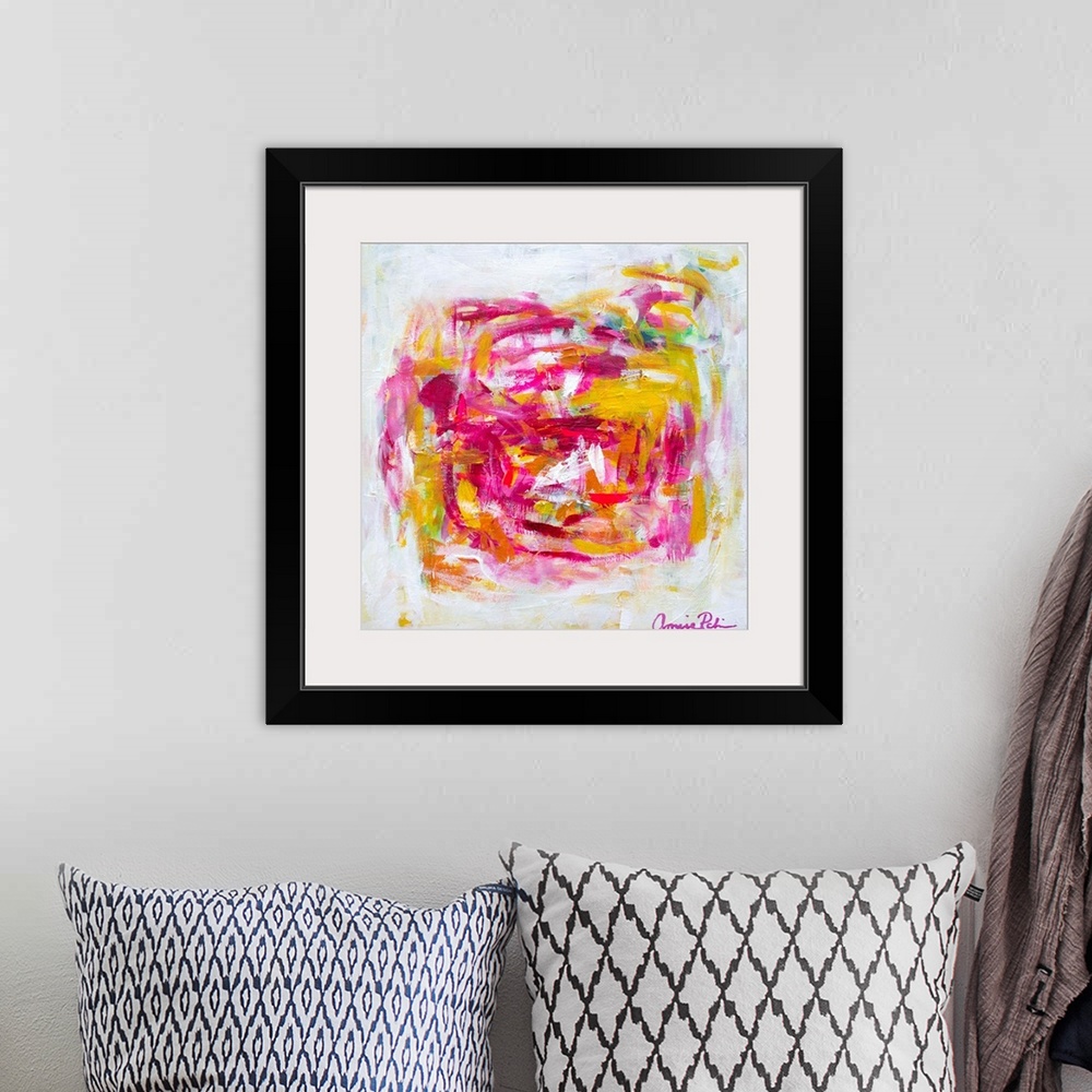 A bohemian room featuring Abstract contemporary artwork in cheerful pinks and yellows.