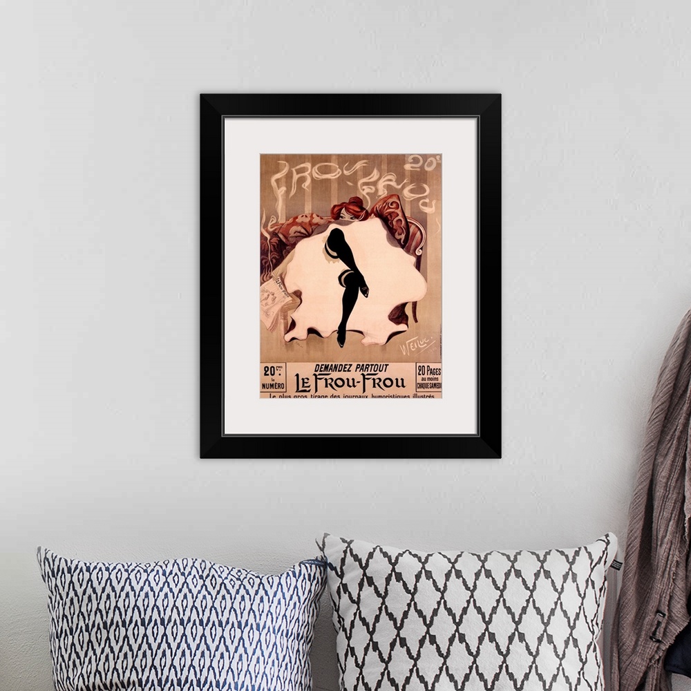 A bohemian room featuring A classic poster with a woman sitting on a couch with her legs crossed and the layers of her dres...