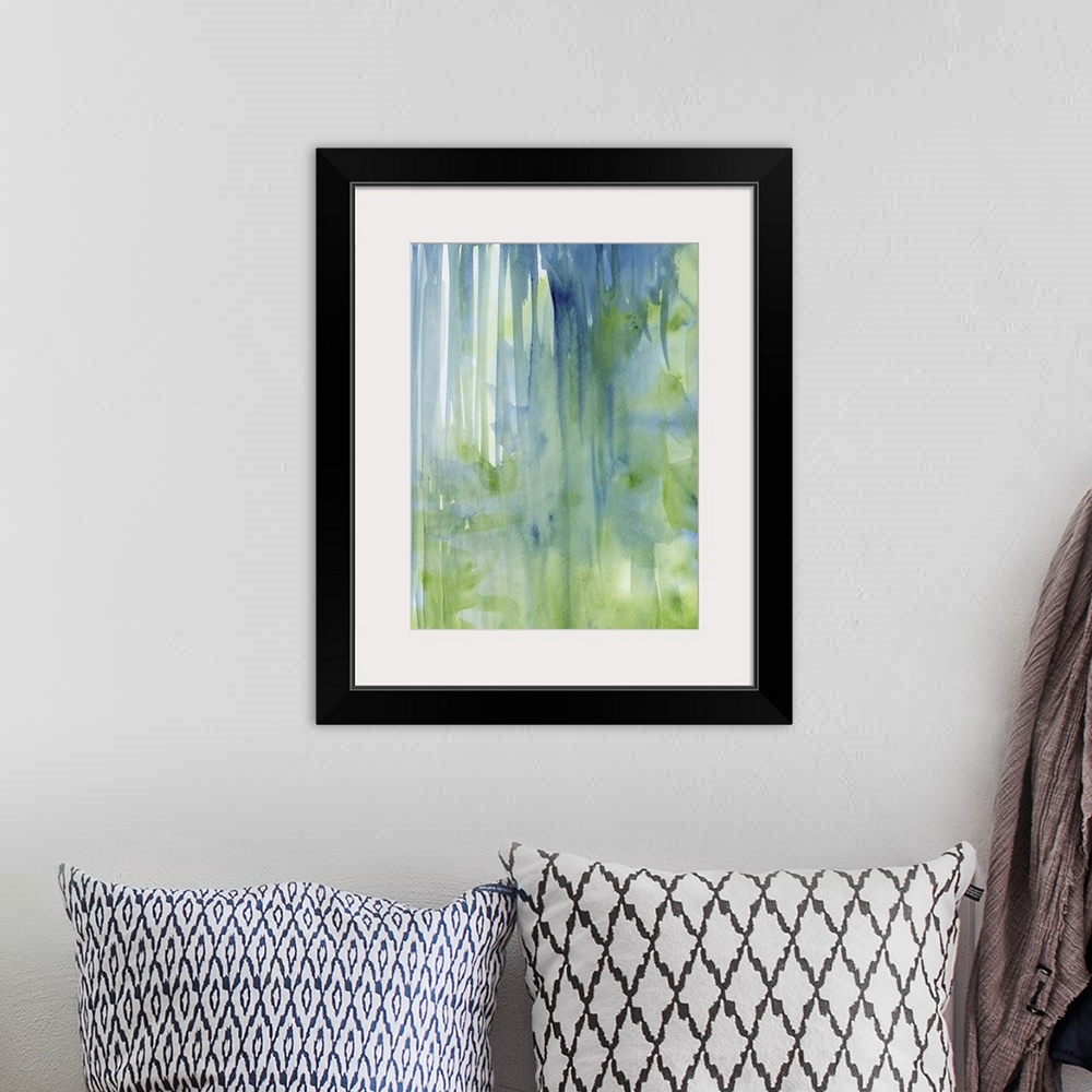 A bohemian room featuring Contemporary abstract painting using green and blue watercolor drips.