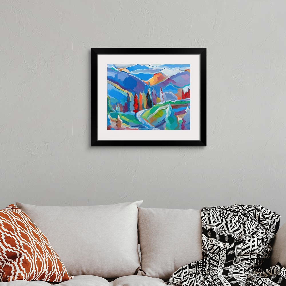 A bohemian room featuring Colorful abstract landscape with trees and mountains.