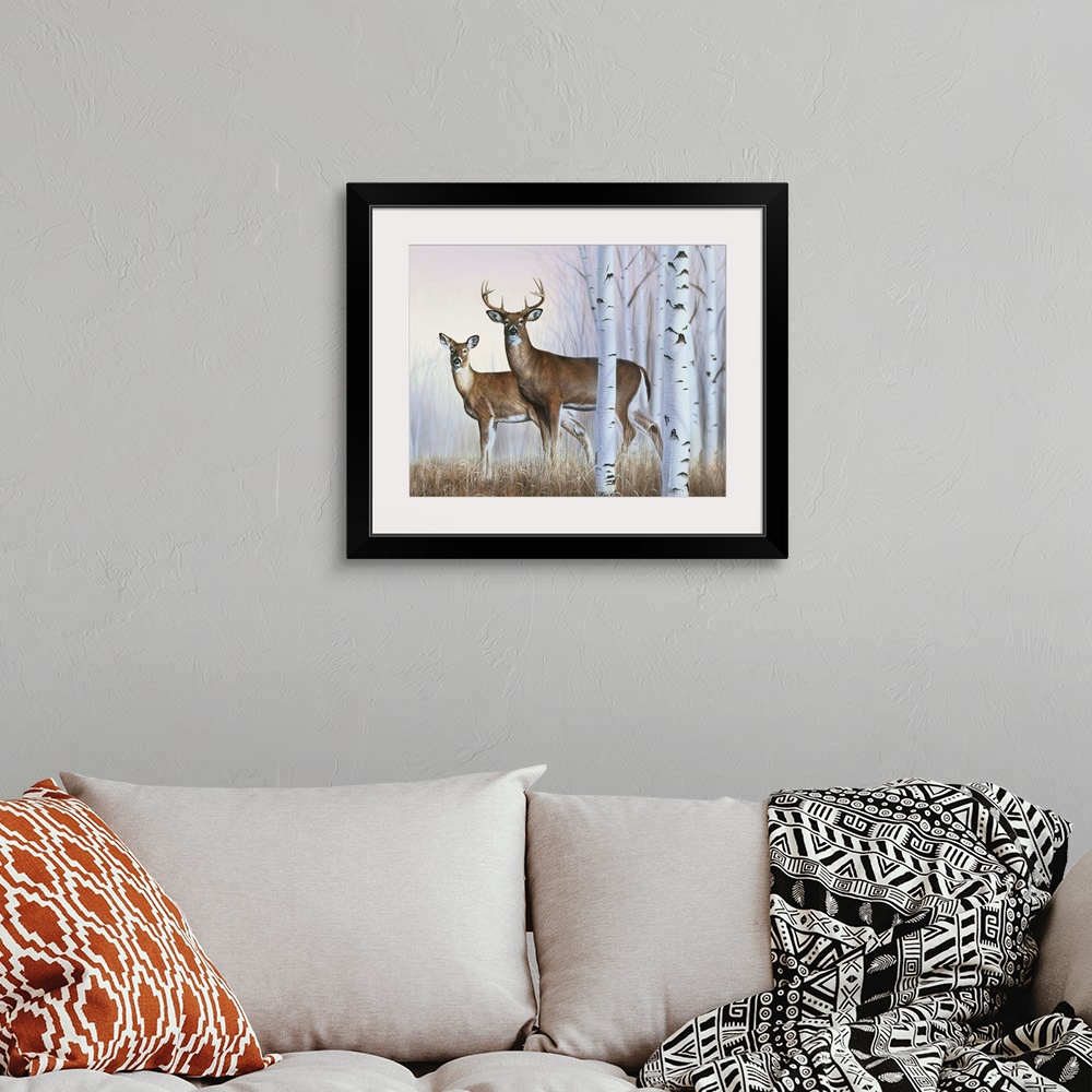 A bohemian room featuring A buck and doe standing behind some white birch trees.