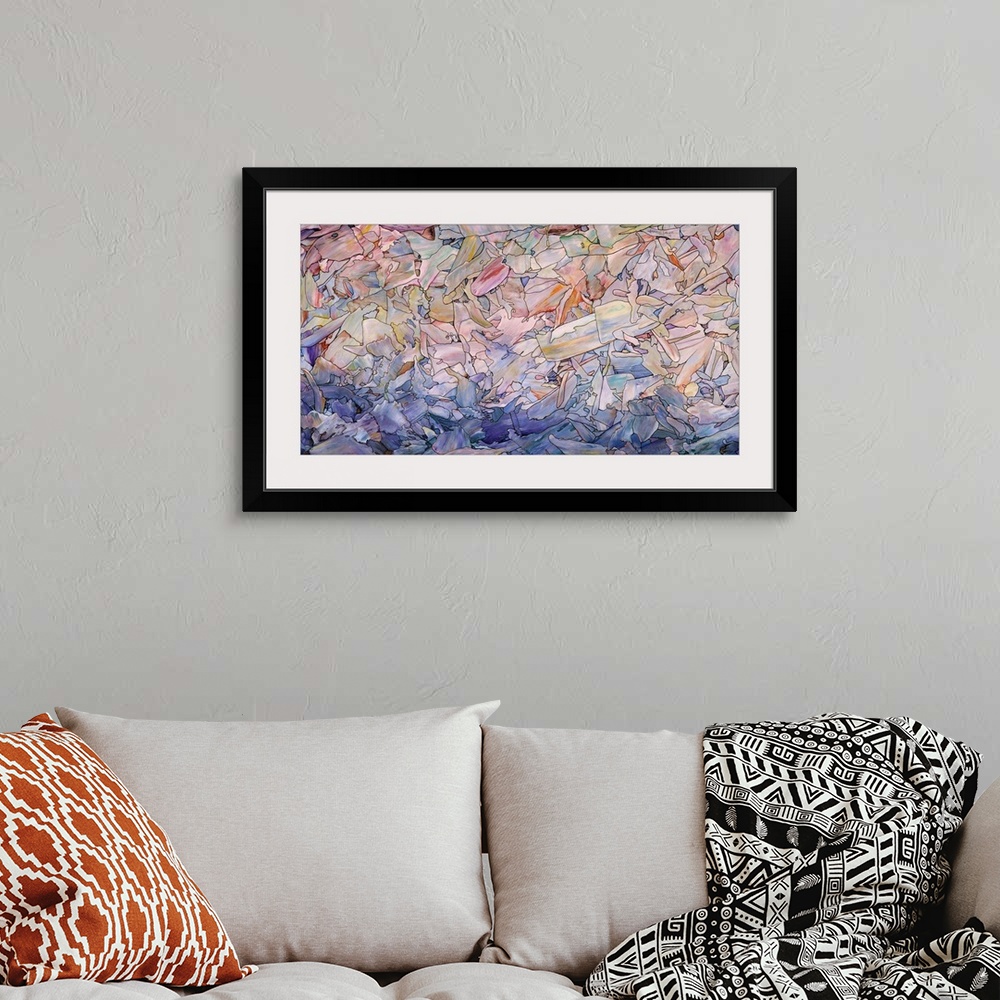 A bohemian room featuring Abstract artwork in the colors of a seascape at dawn.