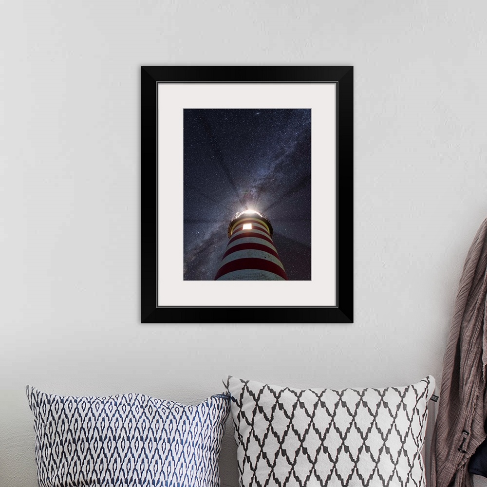 A bohemian room featuring Photograph looking up at a red and white striped lighthouse to a purple and blue starry sky with ...