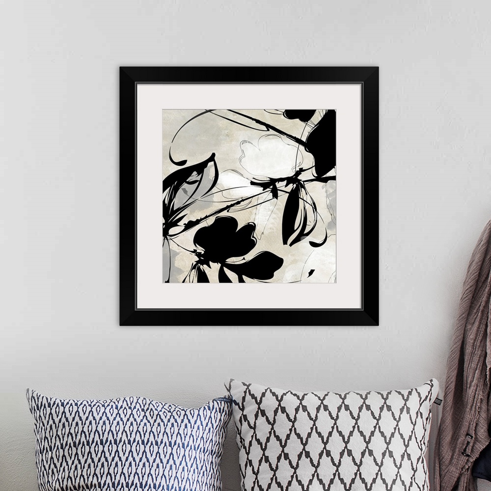 A bohemian room featuring Oversized, square wall art in black and white of a flower and ink design  on a light background.