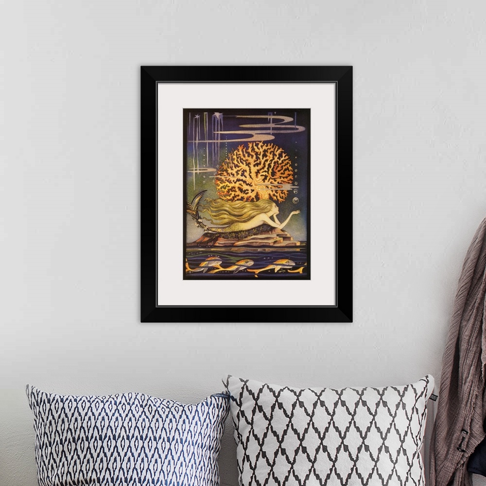 A bohemian room featuring A vintage illustration of a whimsical looking mermaid swimming beside a golden reef.