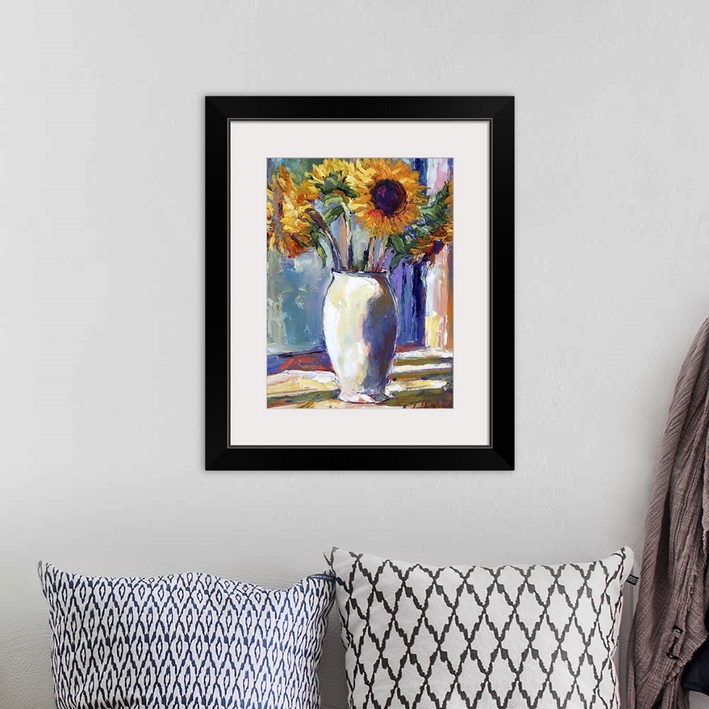 A bohemian room featuring Contemporary colorful painting of sunflowers.