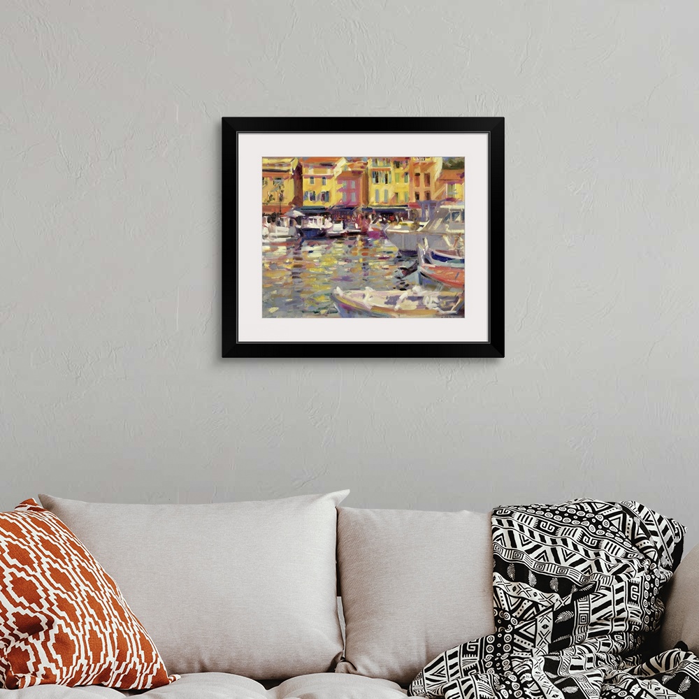 A bohemian room featuring Big, horizontal wall painting of a harbor full of boats in Cassis, France, a row of buildings in ...