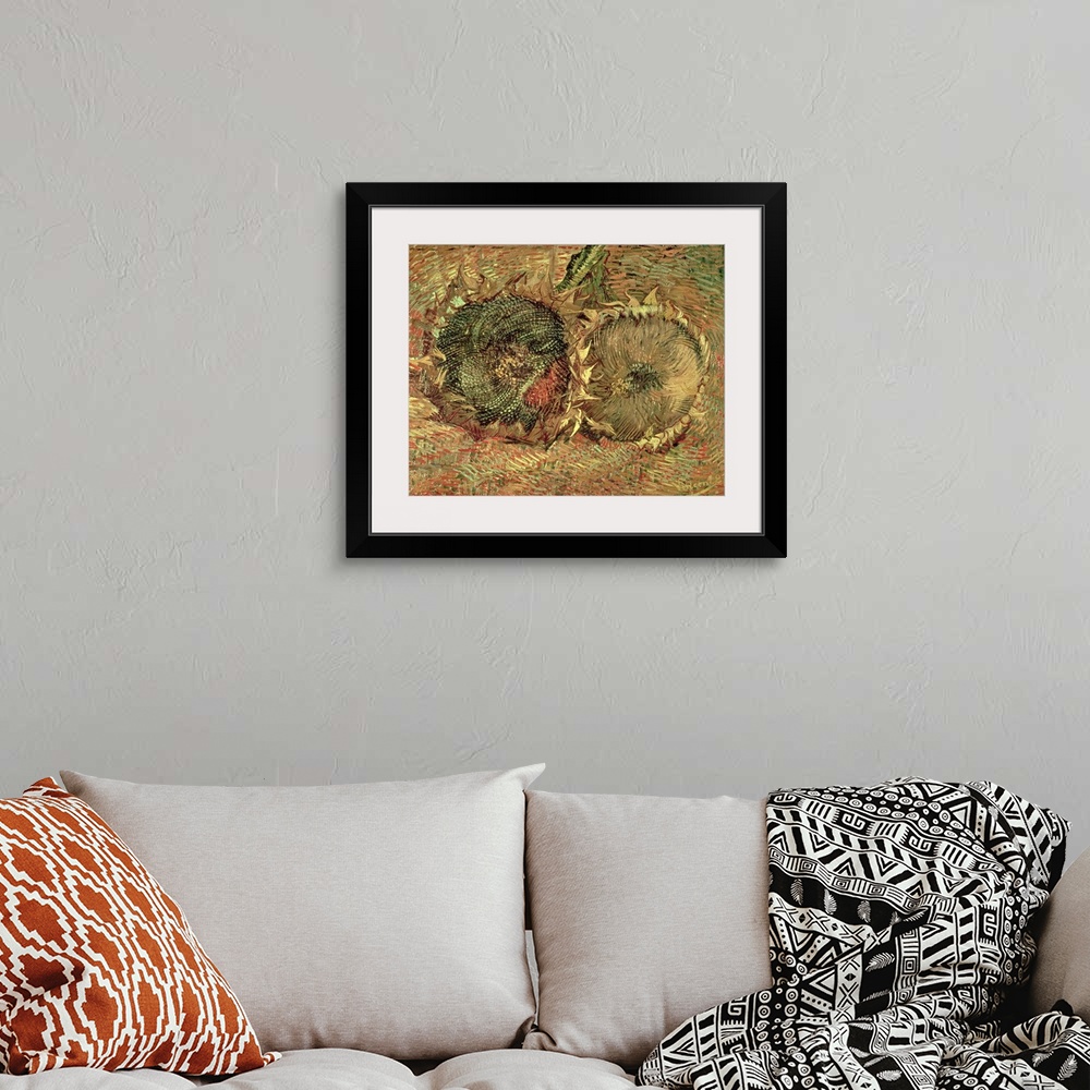 A bohemian room featuring A piece of classic artwork that has two drawn sunflower heads that lay on the ground.