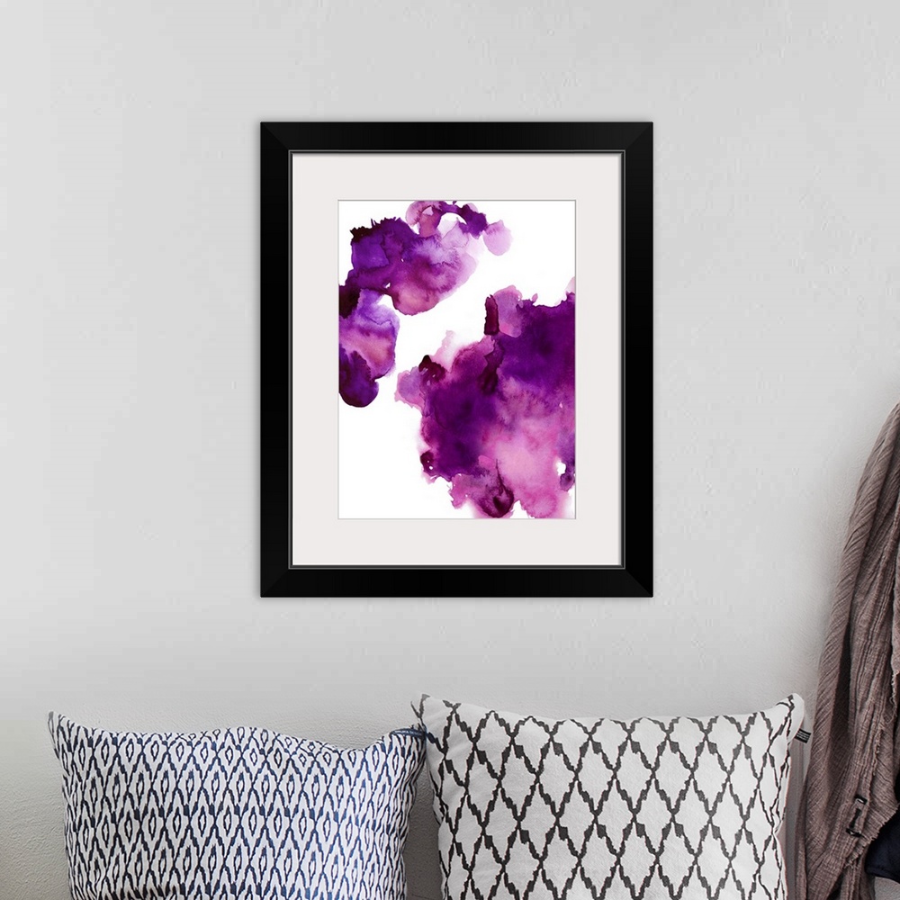 A bohemian room featuring Abstract painting with fuchsia hues splattered together on a white background.