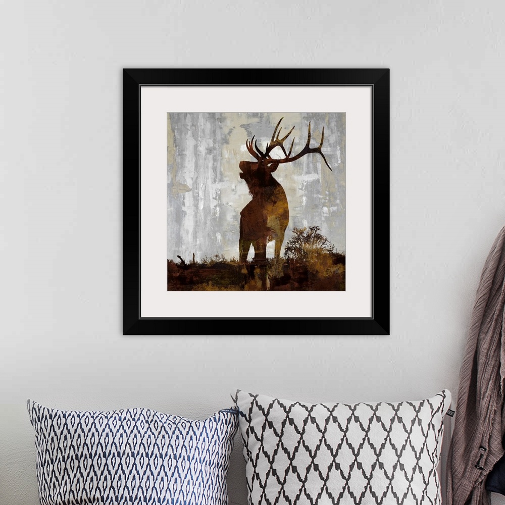 A bohemian room featuring Square decor with a brown and gold silhouette of an elk on a gray, tan, and white background.