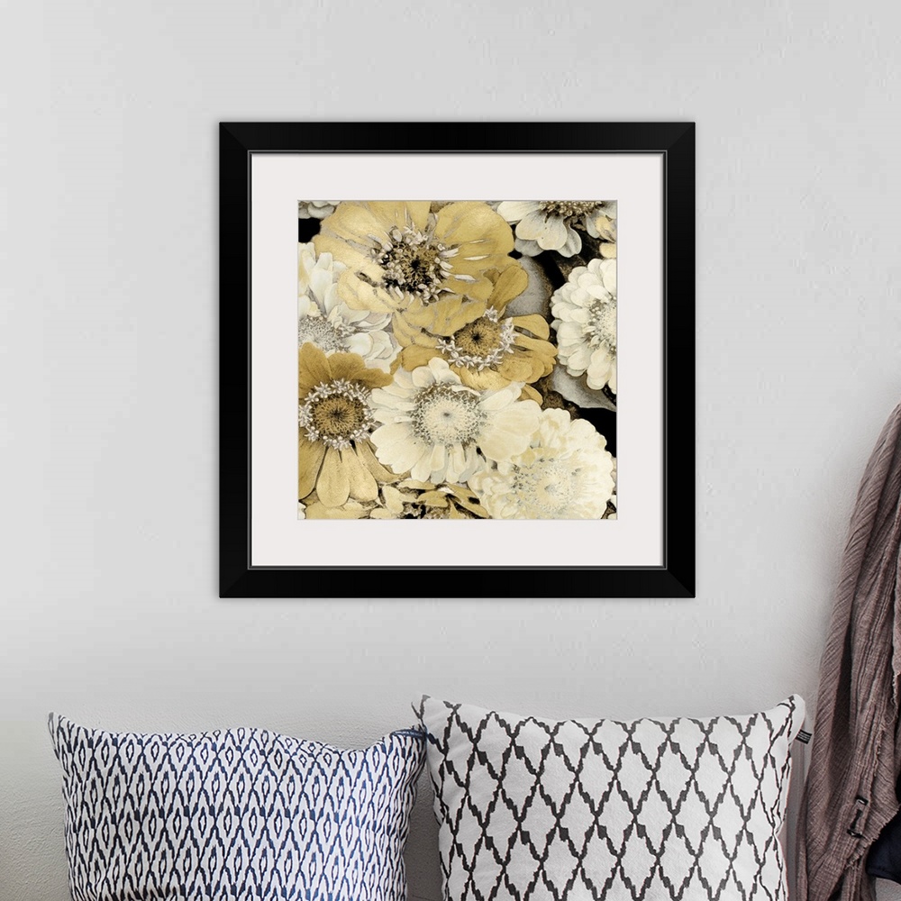 A bohemian room featuring Decorative artwork featuring soft flowers in shades of gold over a black background.