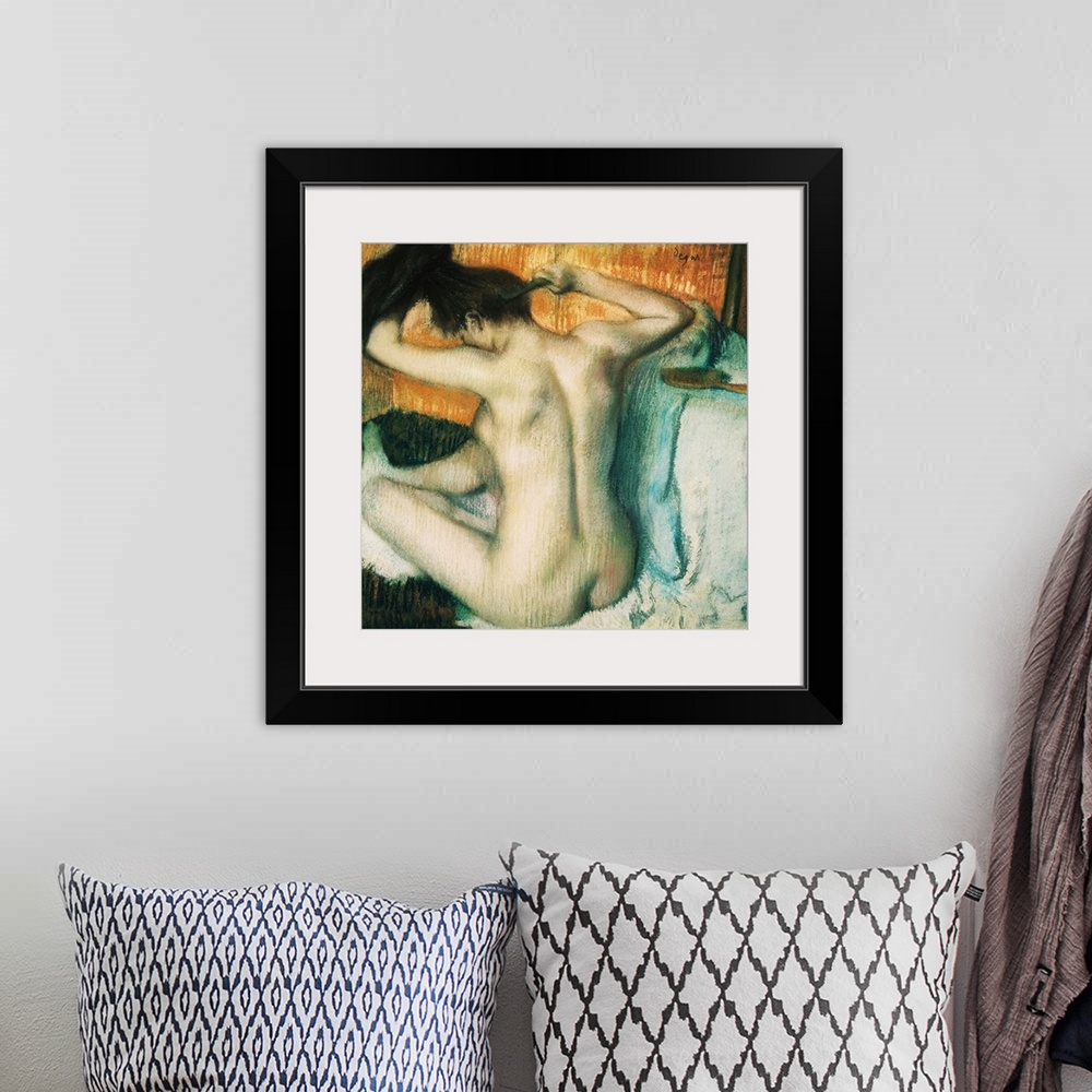 A bohemian room featuring A painting from early 20th century shows nude female figure combing her hair.