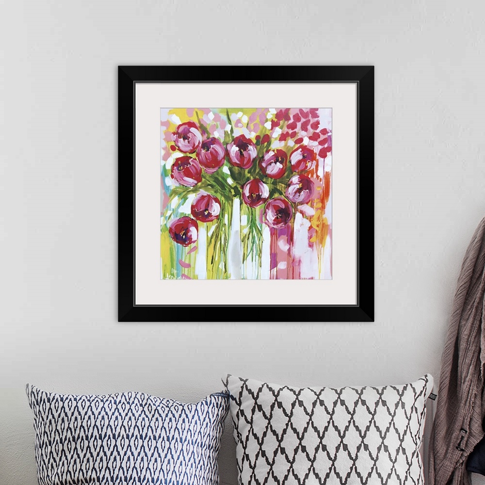 A bohemian room featuring Square contemporary painting of a bunch of pink tulips in vases.
