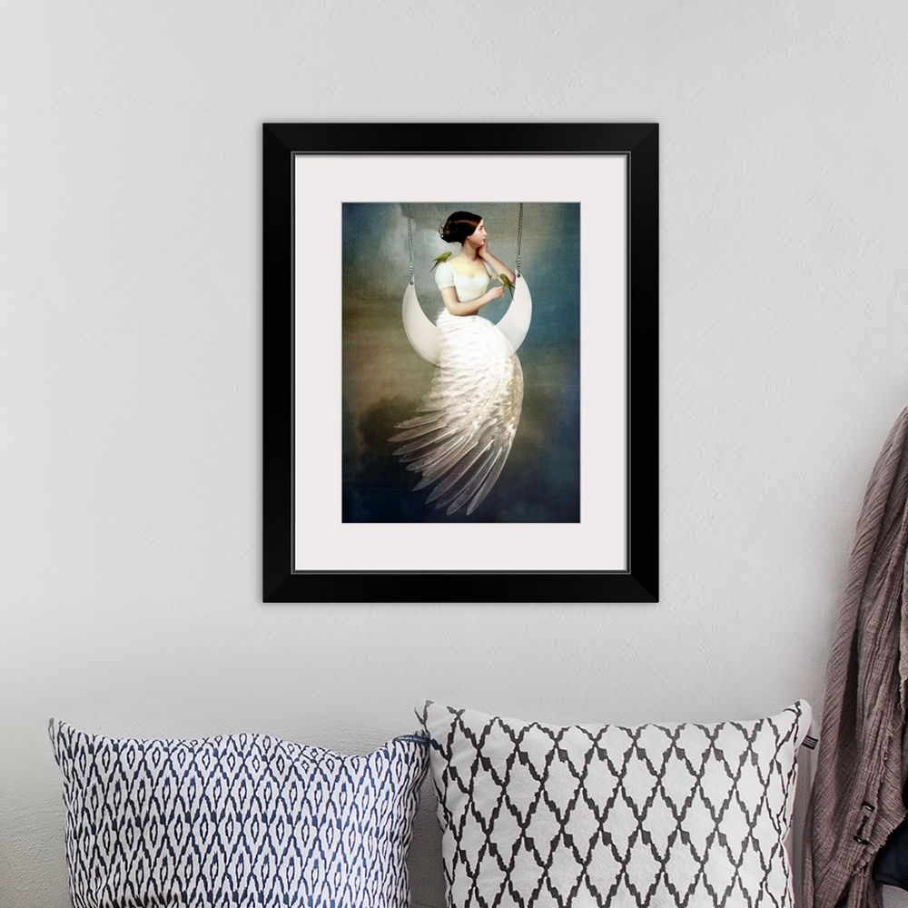 A bohemian room featuring A conceptual portrait of a female with a feather dress sitting on a moon swing.