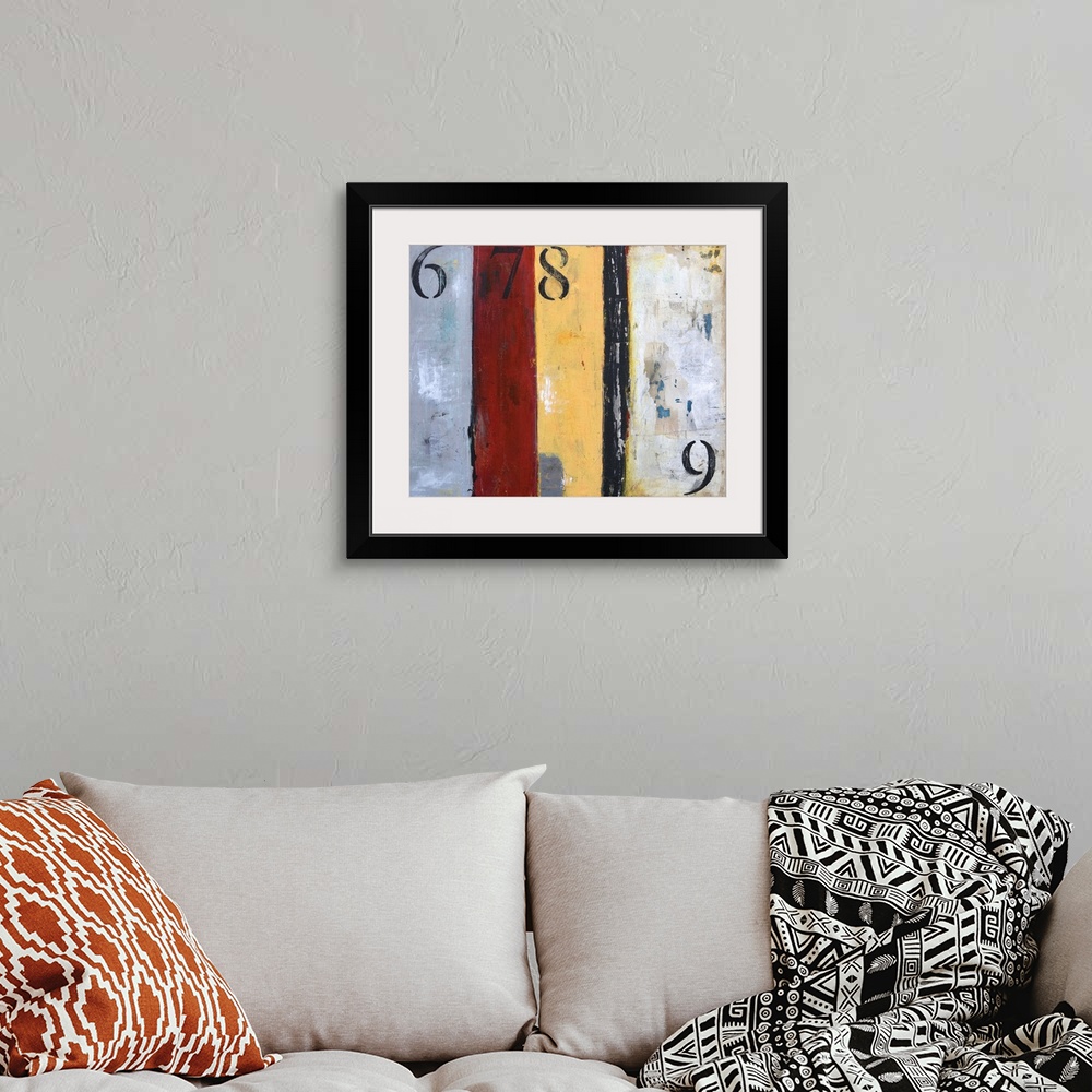 A bohemian room featuring A contemporary abstract painting with grey, red, yellow and black vertical panels and the number ...