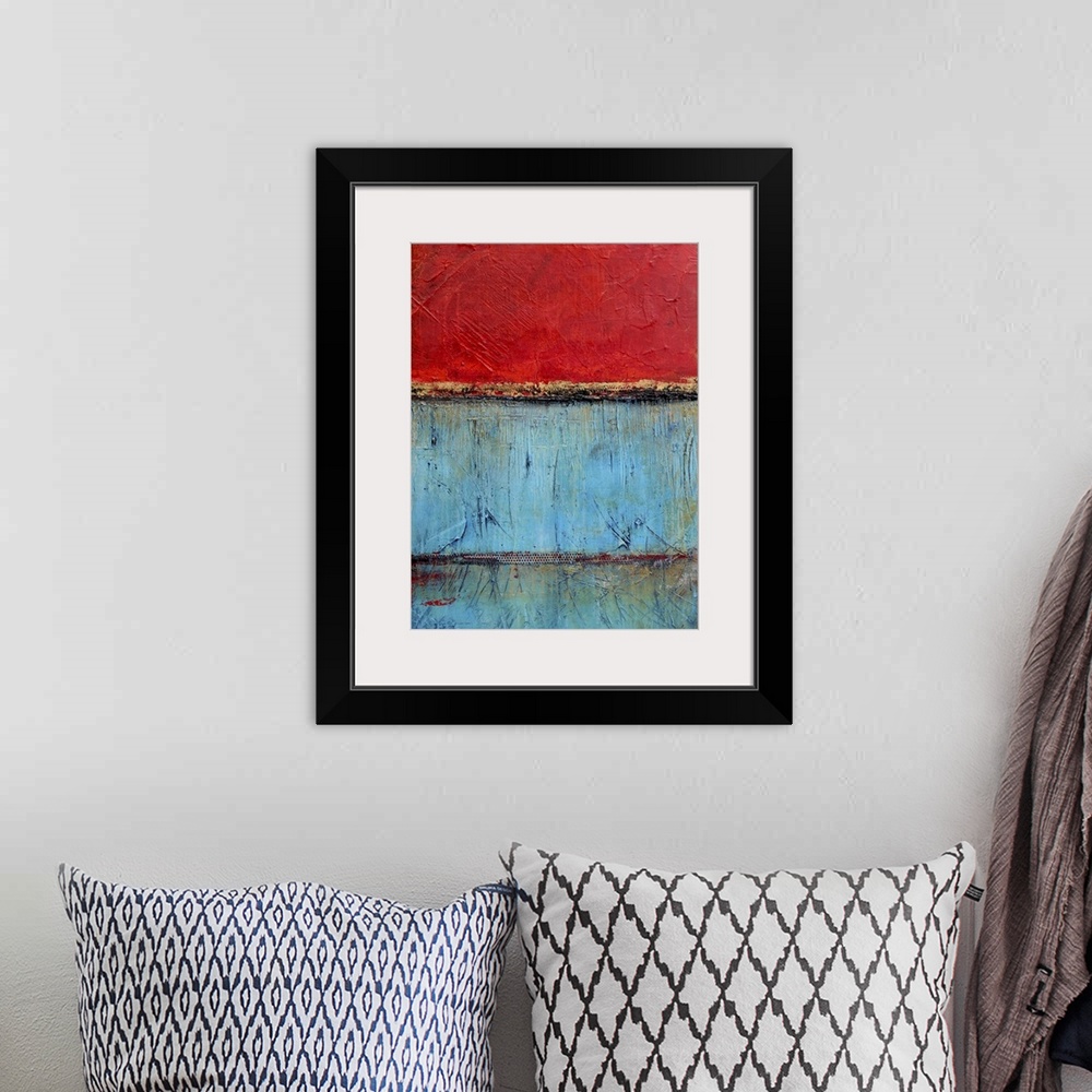 A bohemian room featuring Contemporary abstract painting using bright red and blue contrasting with each other.