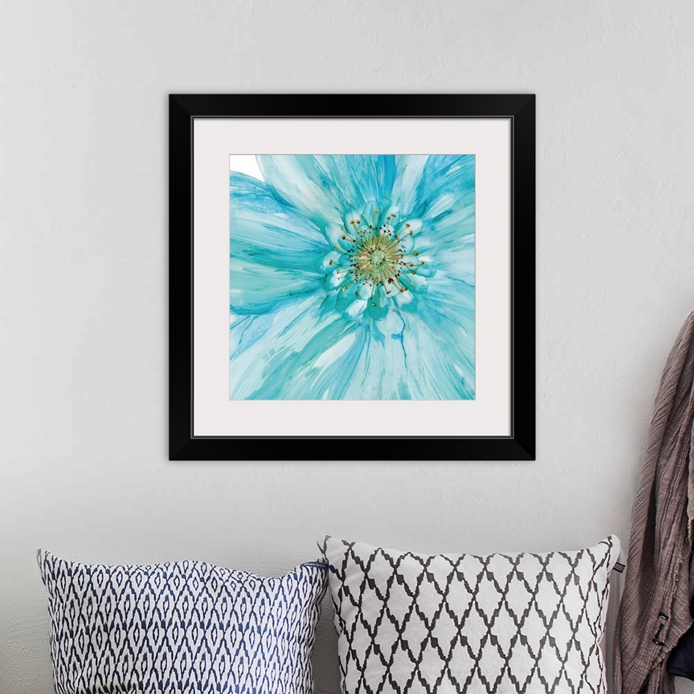 A bohemian room featuring Abstract painting of a blue flower made with watercolors on a square background.