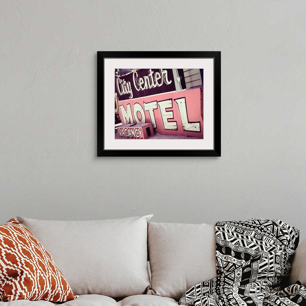 A bohemian room featuring Photograph of a pink and maroon vintage City Center Motel sign from a unique angle.