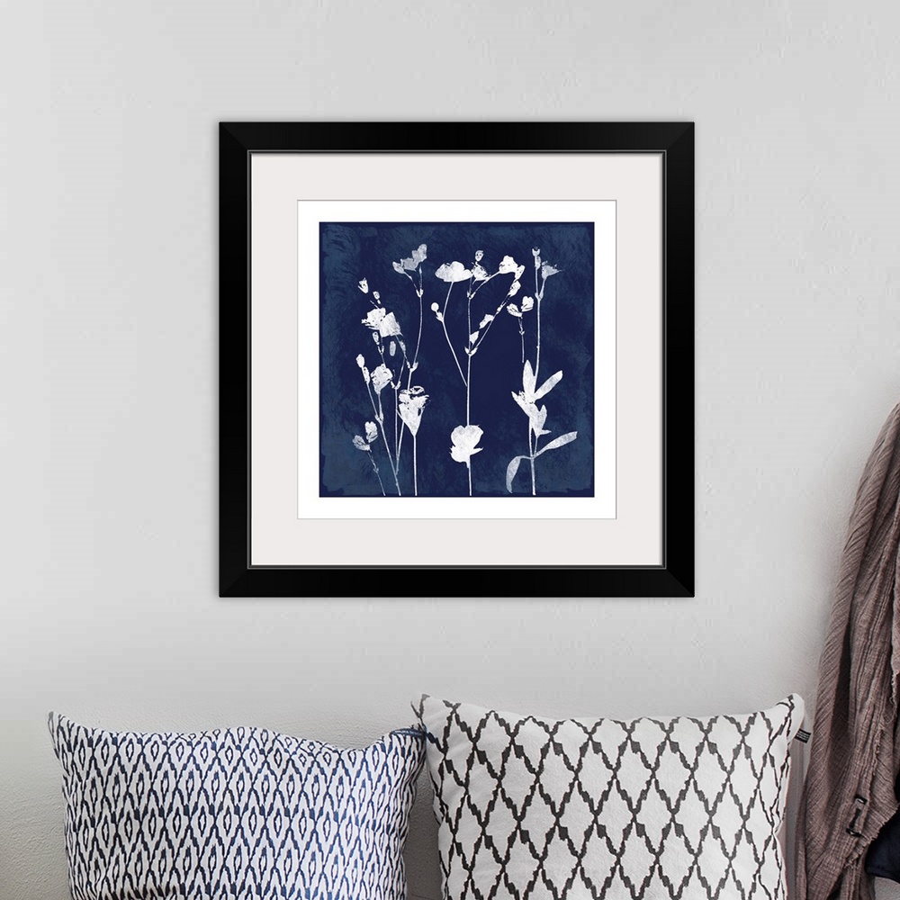 A bohemian room featuring Square cyanotype of white silhouetted flowers on an indigo background with a white boarder.