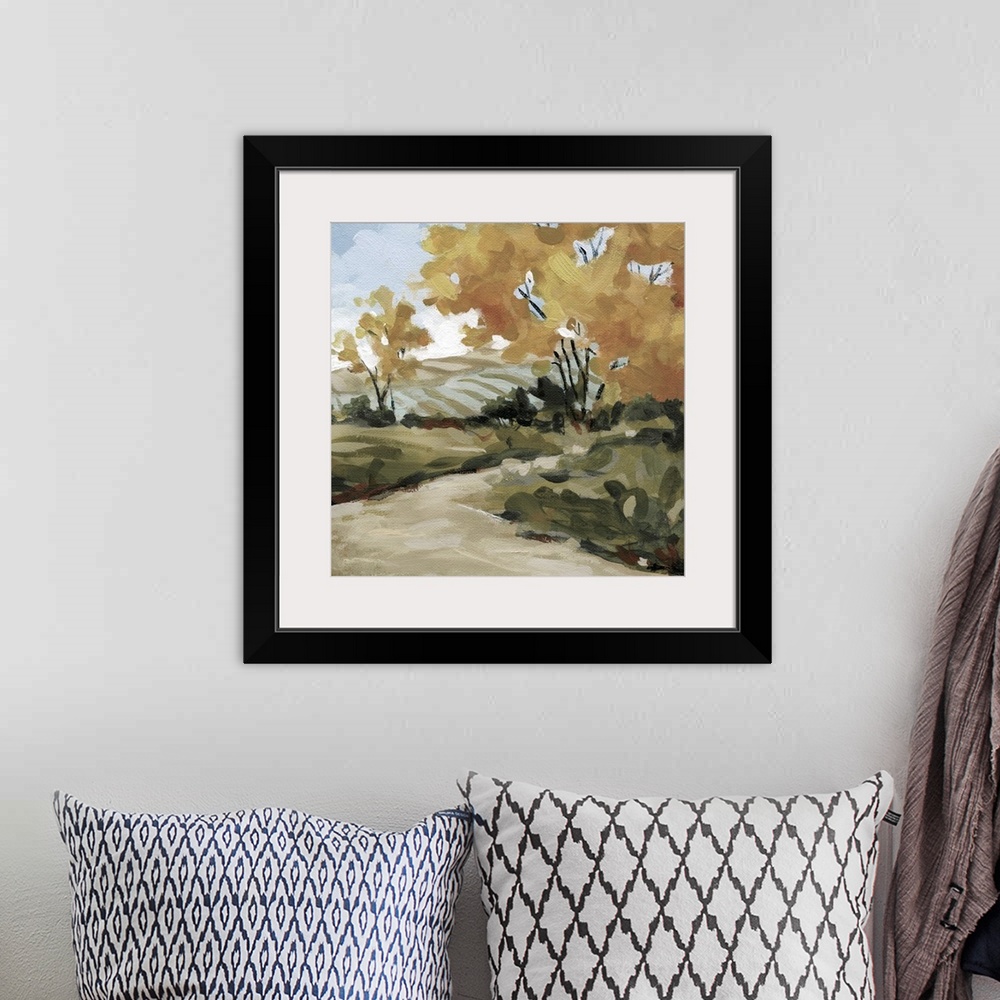 A bohemian room featuring A painting of a pasture surrounded by trees with a pathway created from broad brushstrokes.