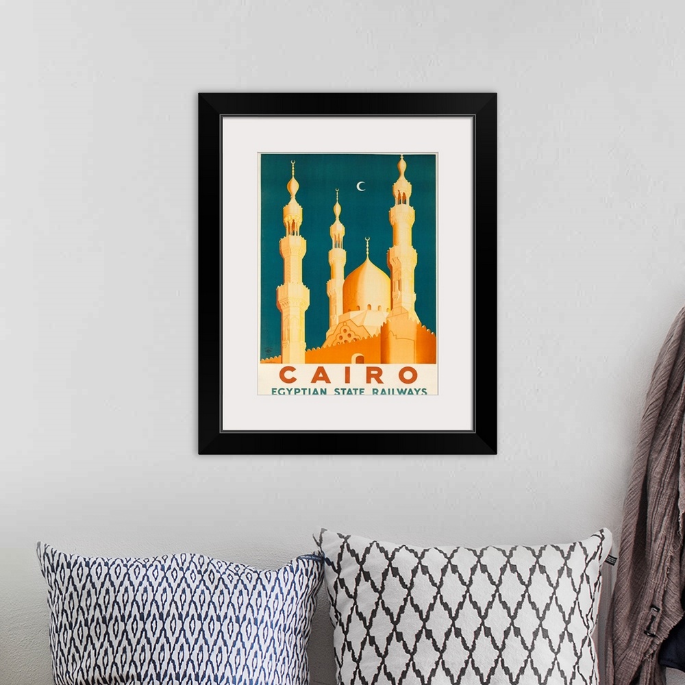 A bohemian room featuring 1930s Ciaro Egypt travel poster showing golden Mosques and minarets in the moonlight