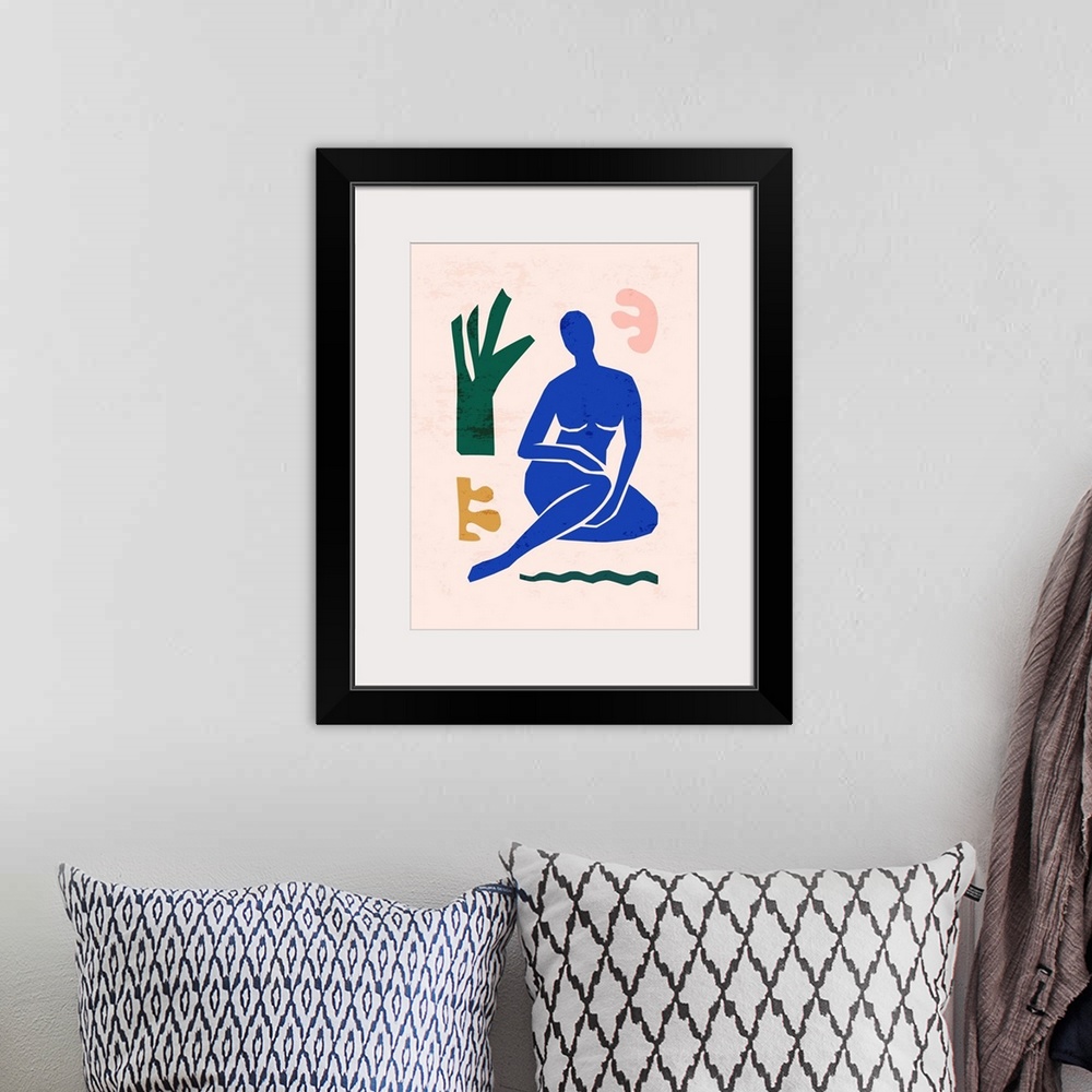A bohemian room featuring Matisse-inspired abstract art of the female figure and organic shapes in a trendy, minimalist style.