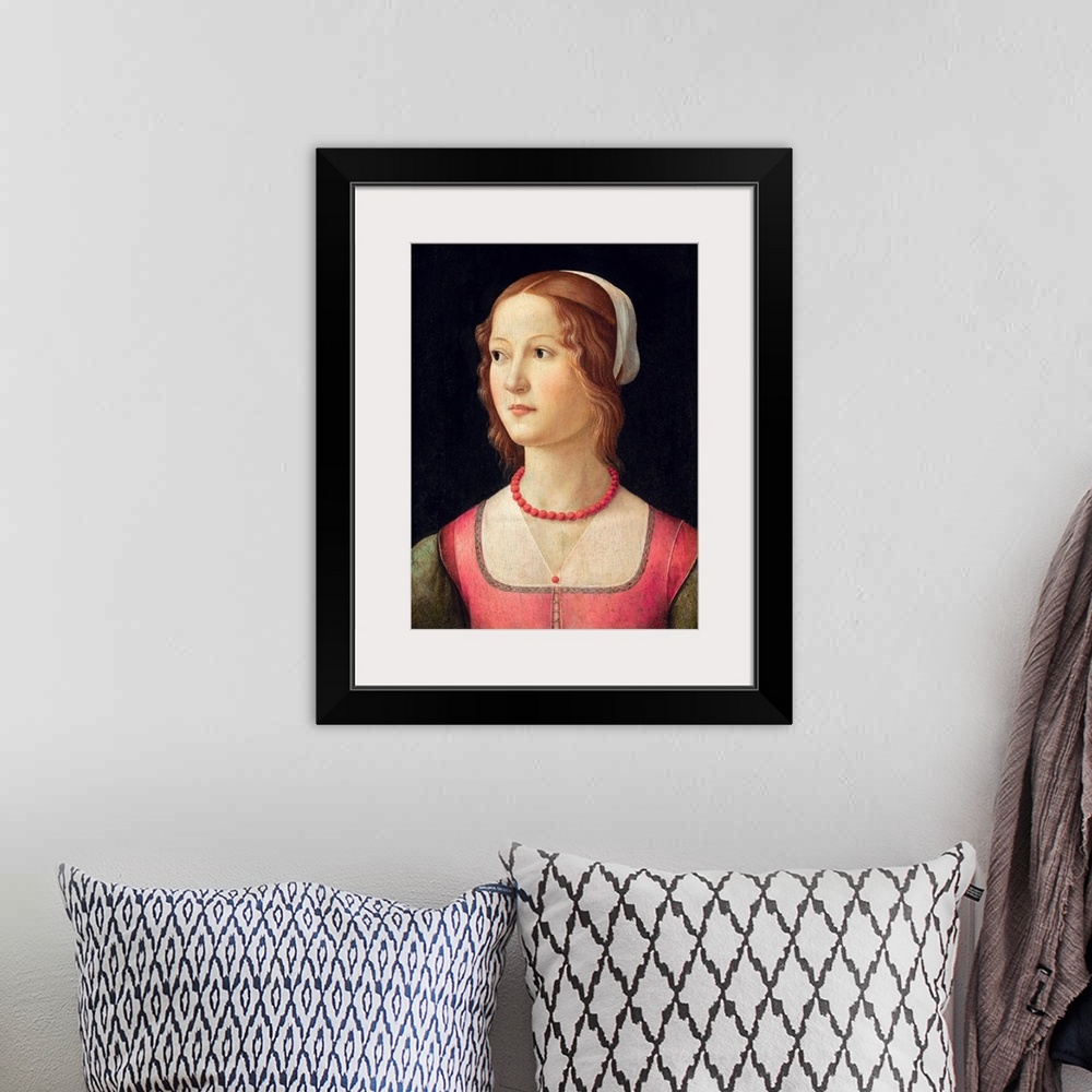 A bohemian room featuring Portrait of a young woman wearing a coral bead necklace. Circa 1485. Tempera on panel. 44 x 32 cm...
