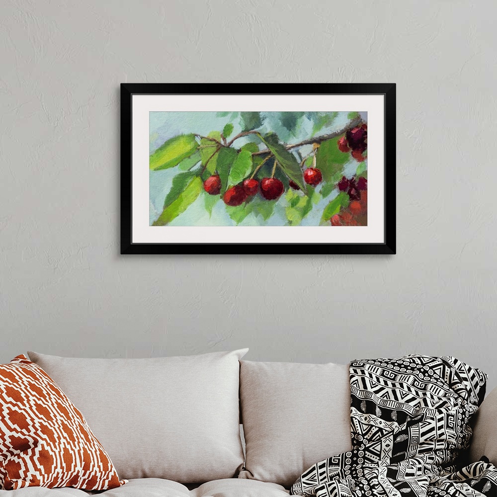 A bohemian room featuring Bright scarlet cherries on a branch.