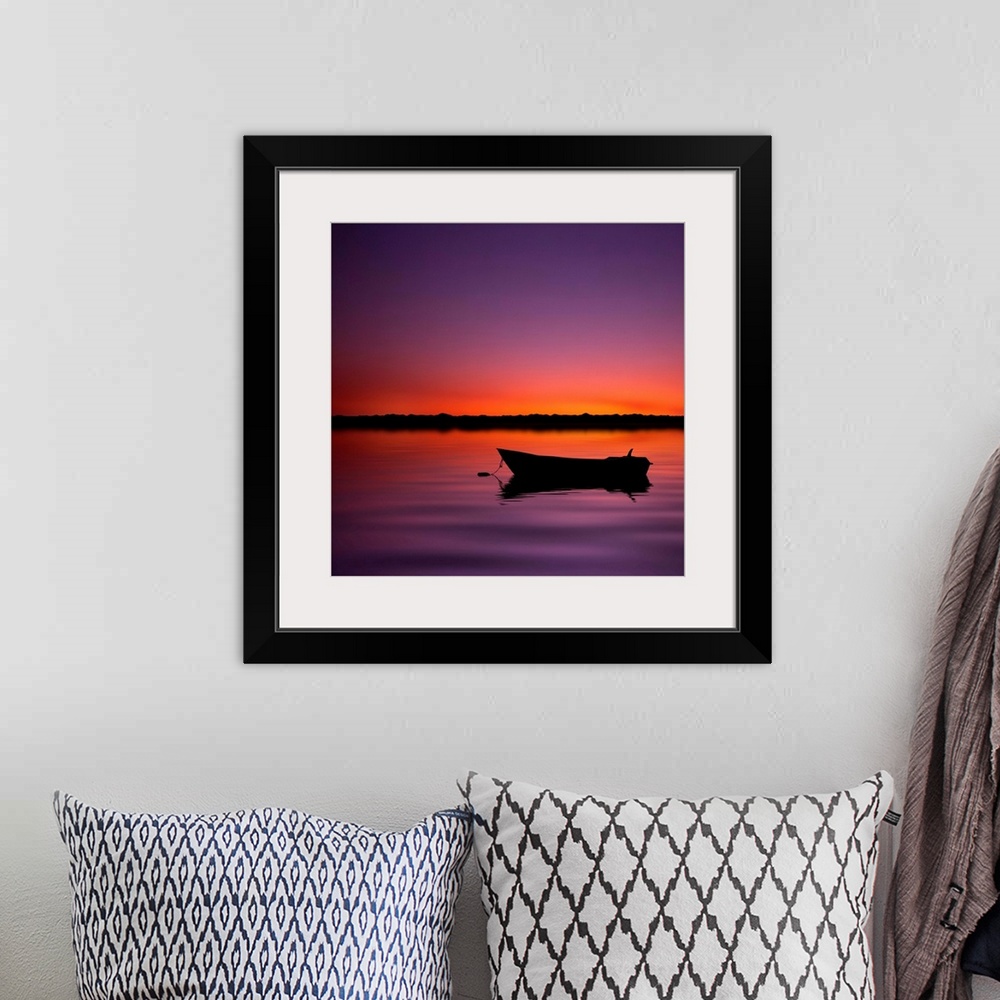 A bohemian room featuring Silhouette boat in lake with sunset.
