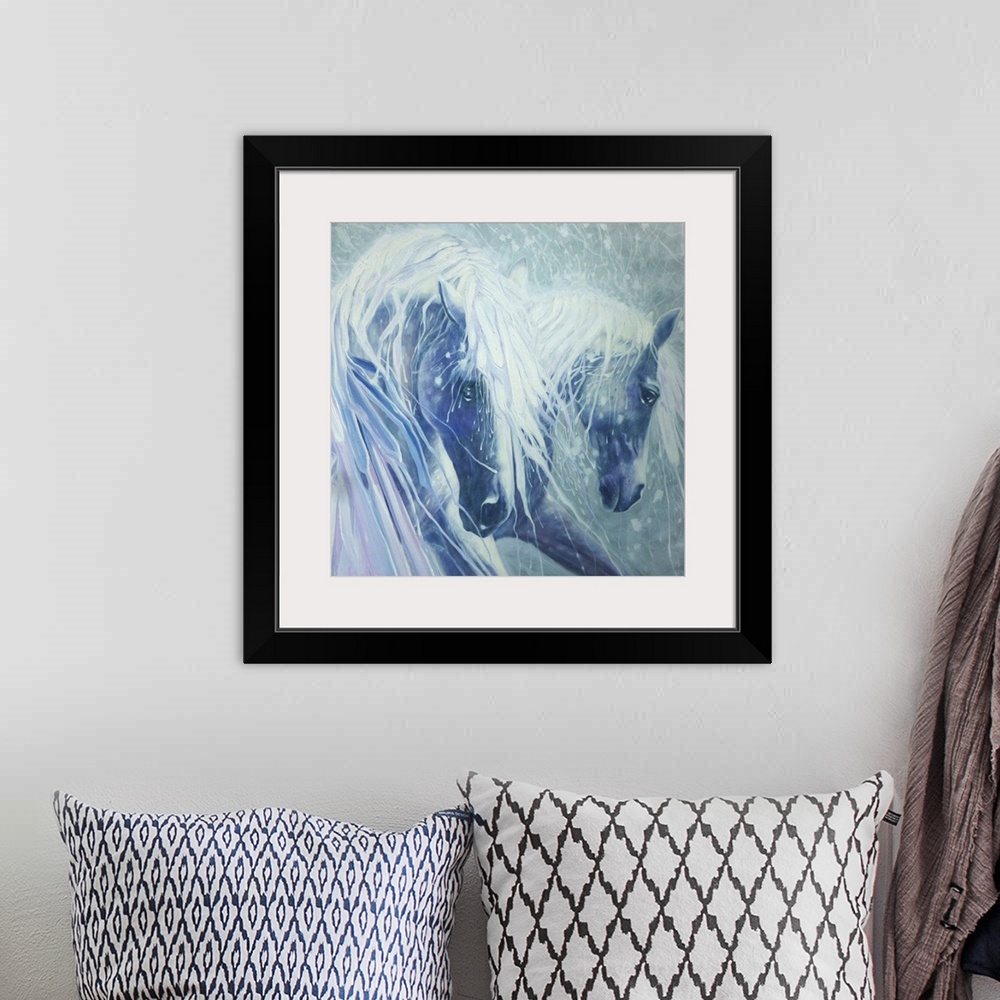 A bohemian room featuring Watercolor painting of a dream-like scene of two horses in shades of blue.