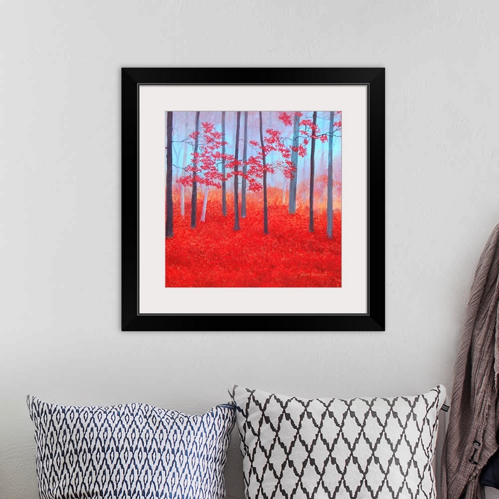A bohemian room featuring Impressionist painting of a red Autumn forest with leaves covering the ground.