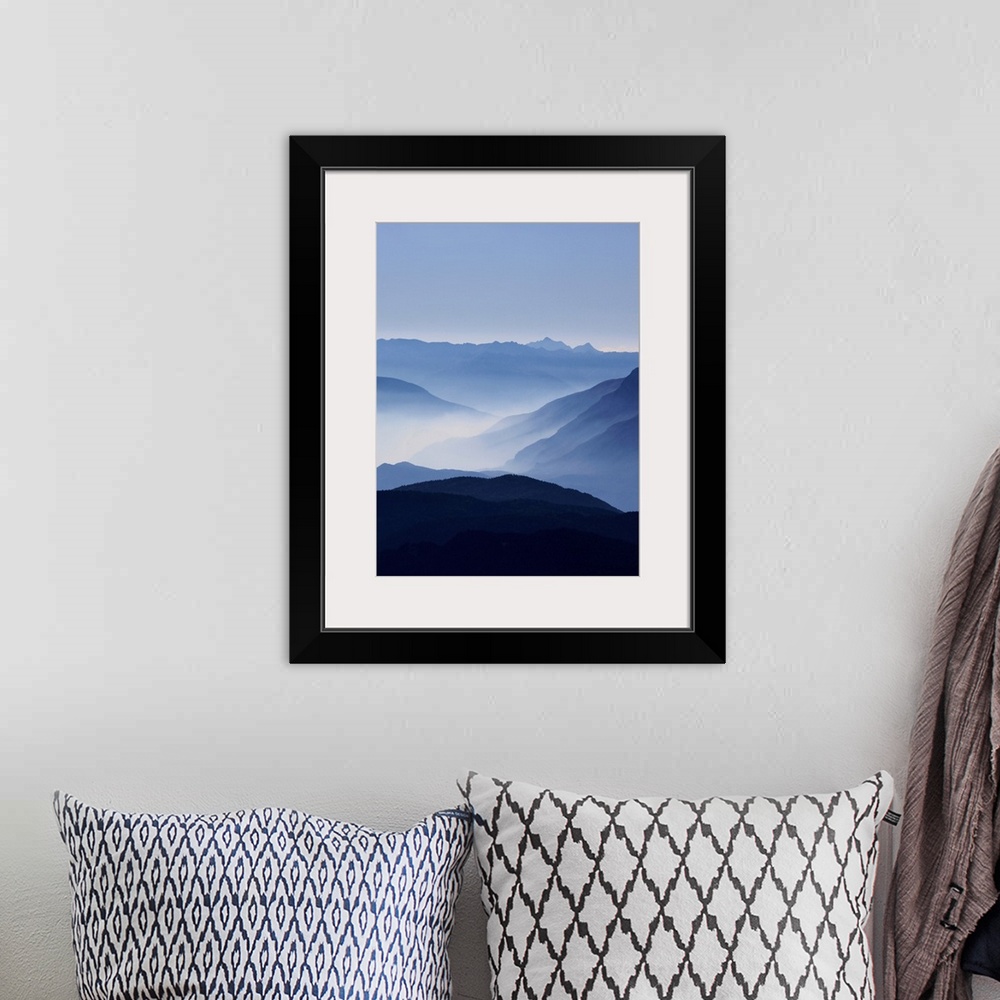 A bohemian room featuring A photograph of clouds along the blue ridge mountains.