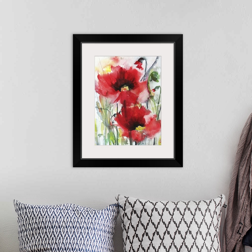 A bohemian room featuring Contemporary watercolor painting of vibrant red flowers.