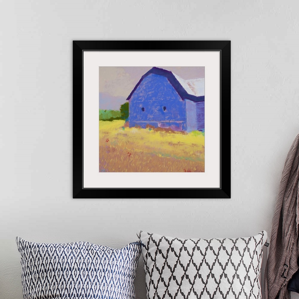 A bohemian room featuring Contemporary painting of a blue barn in a yellow field.