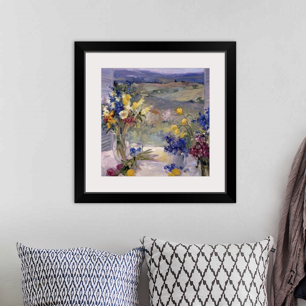 A bohemian room featuring Fine art oil painting still life of lavender, yellow and maroon flowers on a table overlooking th...