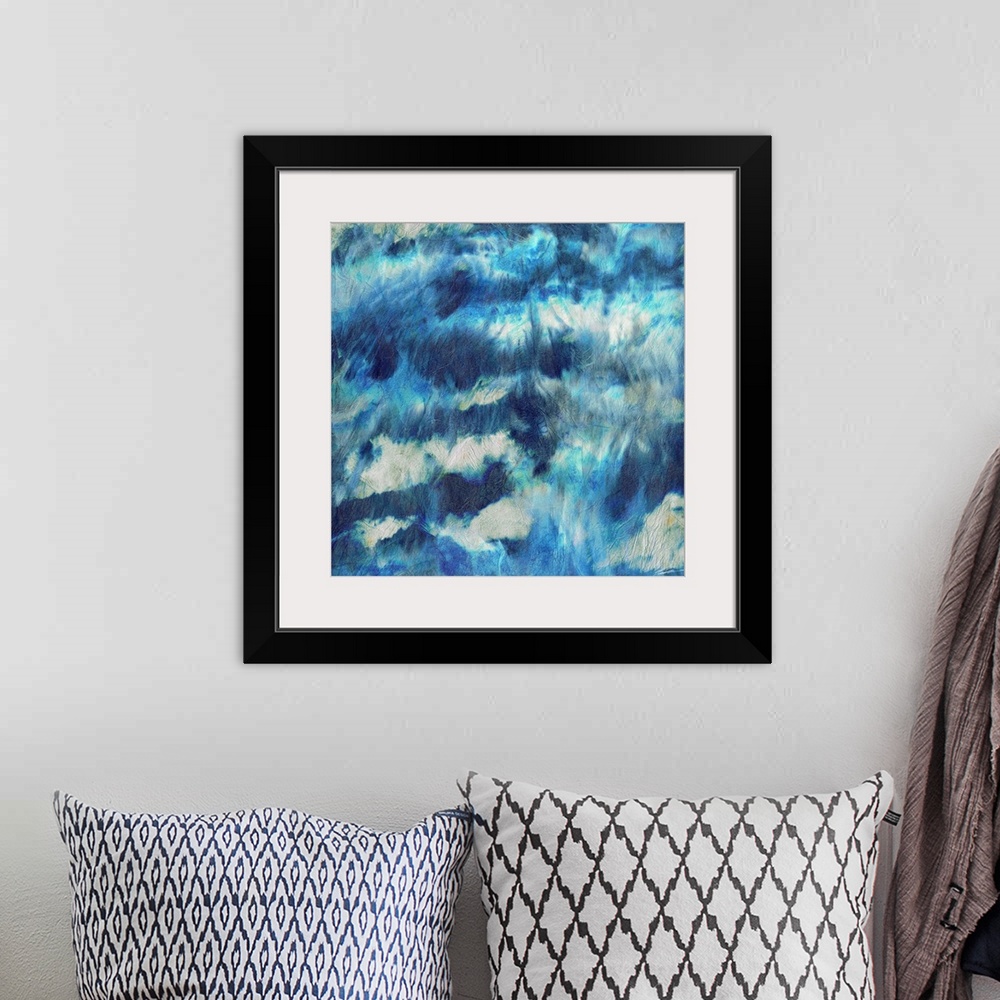 A bohemian room featuring A shibori painted skyscape with iridescent strokes of rainfall.