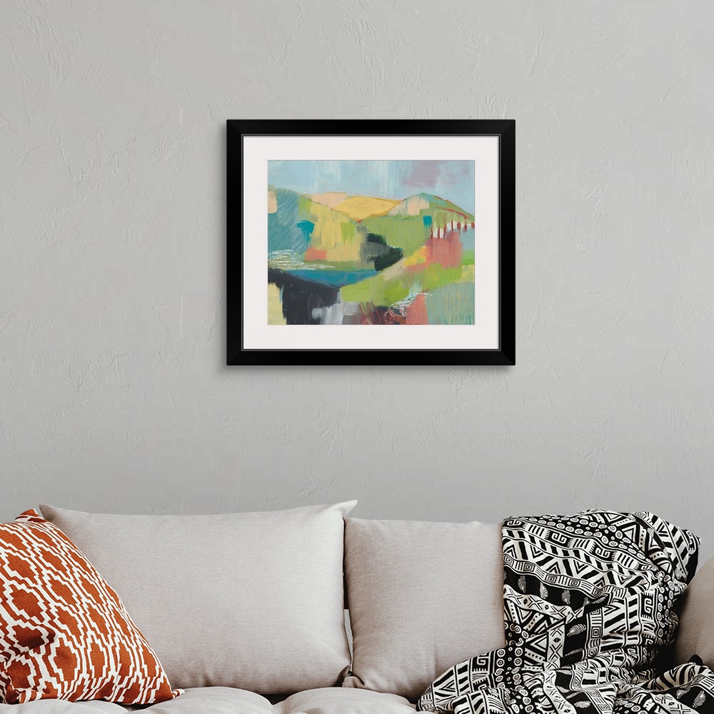 A bohemian room featuring Contemporary painting of a hilly pastel landscape made with patchwork-like brushstrokes.